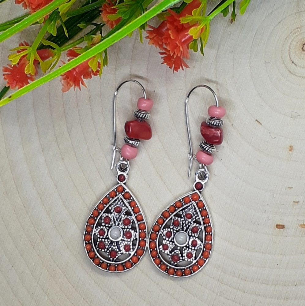 Teardrop shaped dangle earrings available in two colors; carnelian and turquoise